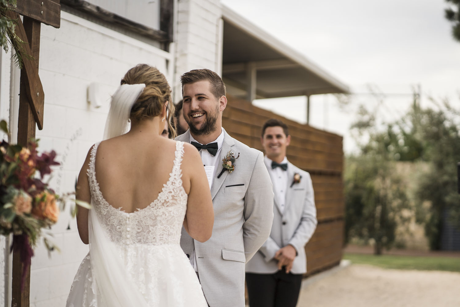 groom smiling during ceremony